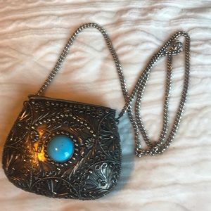 Velvet lined silver plated clutch purse.